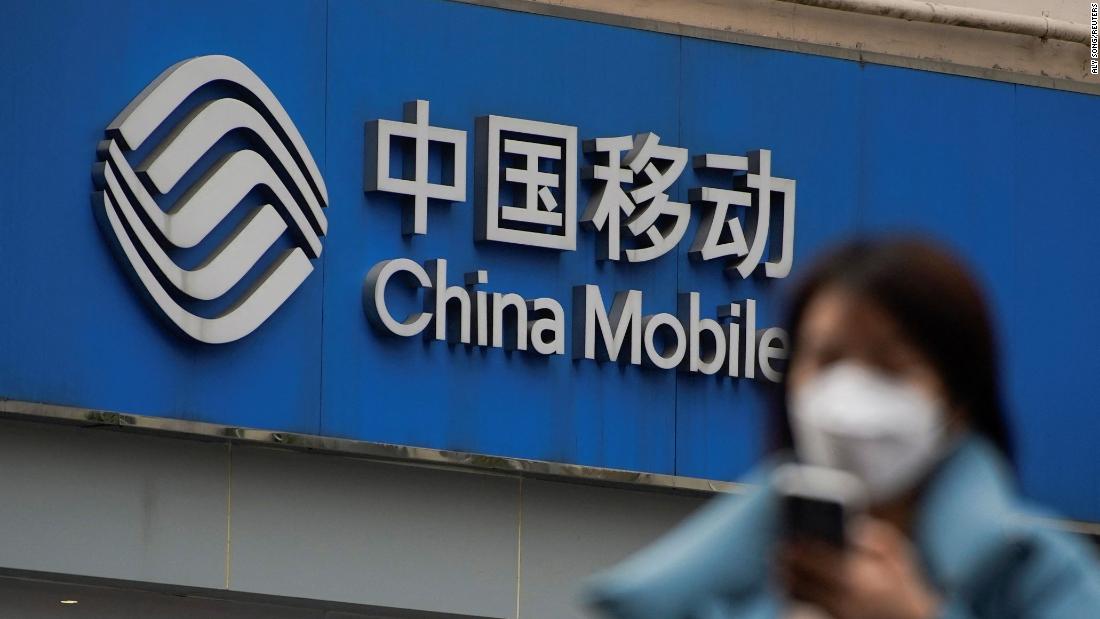 China Mobile shares ascend in Shanghai debut after US exit